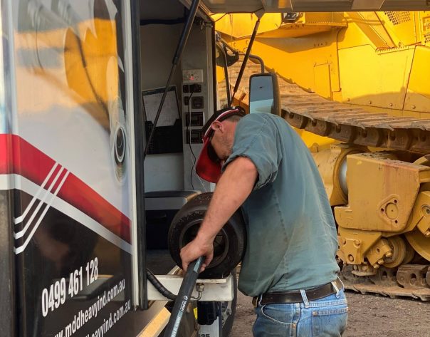 Man Working On Truck — MDD Heavy Industries in Eton, QLD